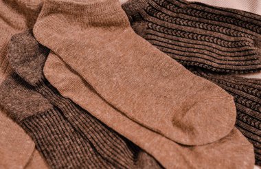 Close up of brown cotton socks autumn cozy clothing.