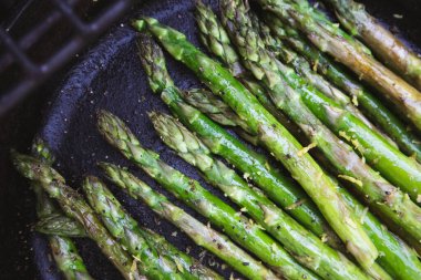 Asparagus Grilled in a Cast Iron Skillet at a Summer Outdoor BBQ
