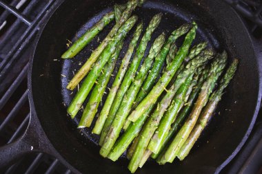 Asparagus Grilled in a Cast Iron Skillet at a Summer Outdoor BBQ