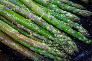 Asparagus Grilled in a Cast Iron Skillet at a Summer Outdoor BBQ