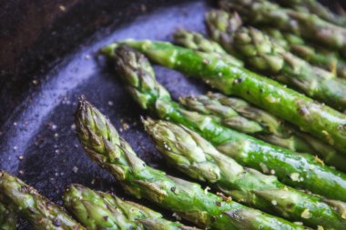Asparagus Grilled in a Cast Iron Skillet at a Summer Outdoor BBQ