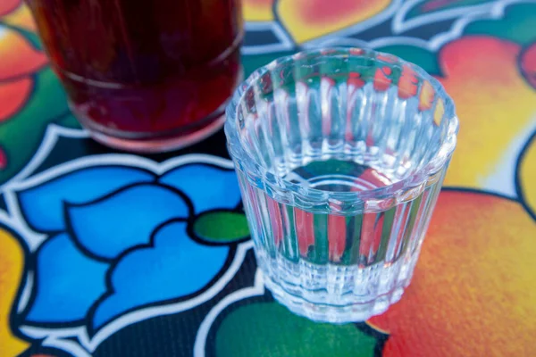 A glass of Mezcal on the table at an Oaxacan restaurant bar in Oaxaca City, Mexico.