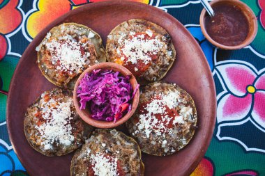 Garnachas on the table at an Oaxacan restaurant in Oaxaca, Mexico - Overhead