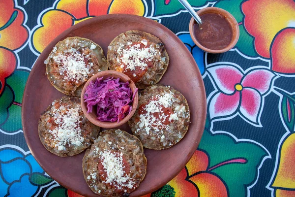 Garnachas on the table at an Oaxacan restaurant in Oaxaca, Mexico - Overhead