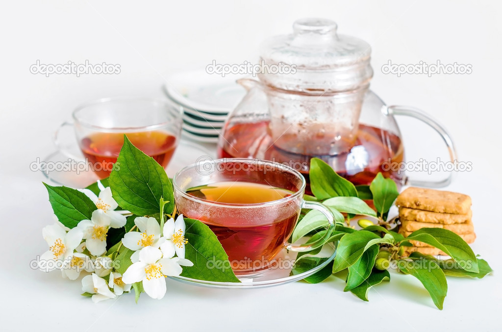 Teapot with tea and jusmine flower
