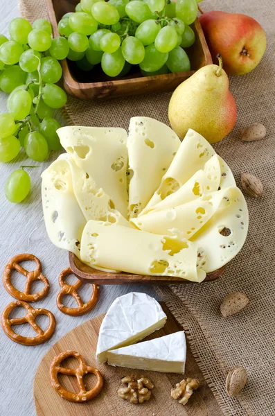 Cheese with fruits and nuts — Stock Photo, Image