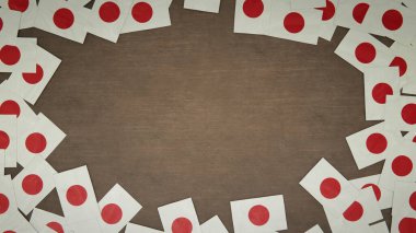 Japonya 'nın kağıt bayraklarından yapılmış çerçeve ahşap masaya dizilmiş. Ulusal kutlama konsepti. 3B illüstrasyon