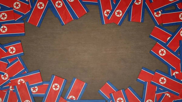 Kuzey Kore Nin Kağıt Bayraklarından Yapılmış Çerçeve Ahşap Masaya Dizilmiş — Stok fotoğraf