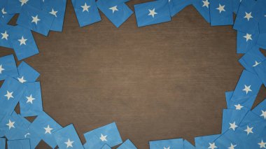 Ahşap masaya dizilmiş Somali 'nin kağıt bayraklarından yapılmış çerçeve. Ulusal kutlama konsepti. 3B illüstrasyon