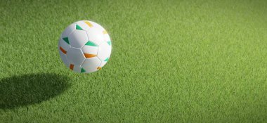 Futbol ya da futbol topu tasarımı Fildişi Sahili bayrağıyla çimen zeminine karşı. 3B görüntüleme
