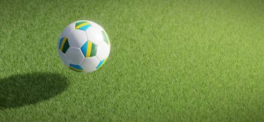 Futbol ya da futbol topu tasarımı Ruanda bayrağıyla çimen zeminine karşı. 3B görüntüleme