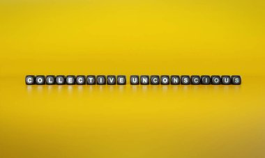 Koyu ahşap bloklardaki düz sarı arkaplana karşı beyaz metinlerde kollektif bilinçsiz sözcükler