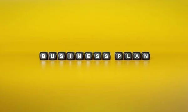 Words Business Plan Spelled Out White Text Dark Wooden Blocks — Stock Photo, Image