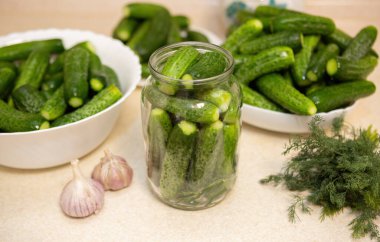 Plates and jars filled with organic cucumbers