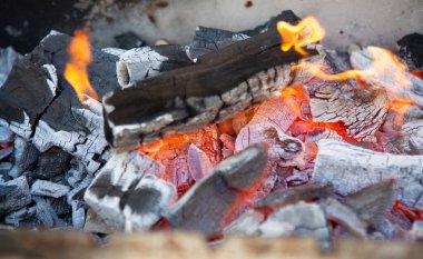 The charcoal for the kebab is burning in the charcoal grill