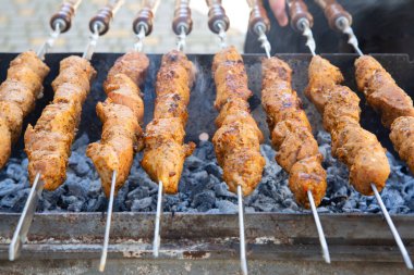 Shish kebab is prepared on a charcoal grill