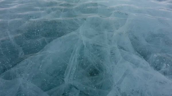 Transparent Turquoise Ice Close Full Screen Wavy Surface Cracks Bubbles — Stock fotografie