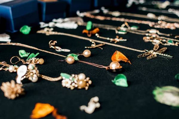 stock image Women's jewelry made of stone on a fabric background closeup