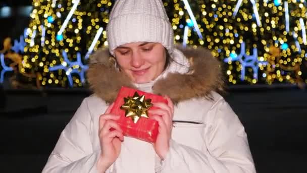 Young Woman Holds Red Gift Box Bow Standing Christmas Tree — Stock videók