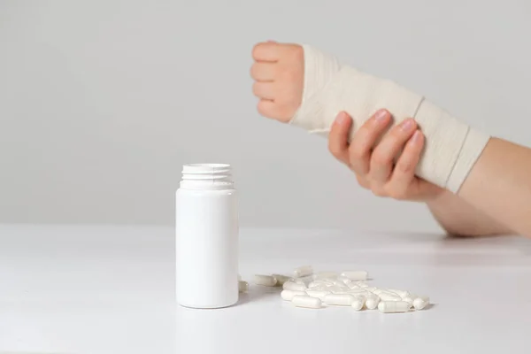 Persons Hand Elastic Bandage Jar Calcium Chondroitin Tablets Treatment Fractures — Stock Photo, Image