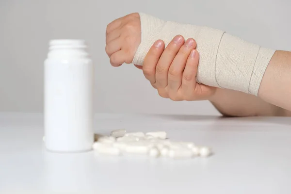 Persons Hand Elastic Bandage Jar Calcium Chondroitin Tablets Treatment Fractures — Stock Photo, Image