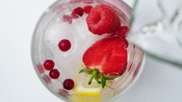 Process Pouring Water Summer Cocktail Strawberries Berries Lemon Ice — 图库视频影像