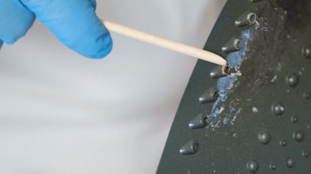 Woman Cleans Sole Iron Carbon Deposits Orange Stick — Video