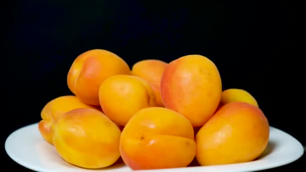 Ripe Apricots Plate Spin Circle Black Background — Stock Video