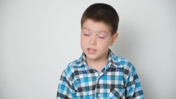 Year Old Boy Nods His Head Raises His Eyebrows Moves – stockvideo