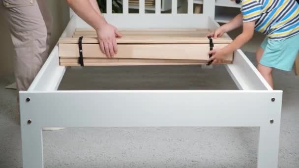Father Son Together Assemble Children Bed Installs Slats — Wideo stockowe