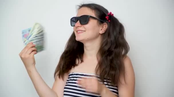 Young Cheerful Woman Sunglasses Waves Money Fan — Vídeo de Stock