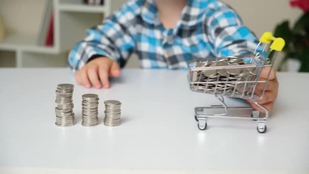 Preschool Boy Plays Coins Knocks Towers Coins Cart — Vídeo de Stock