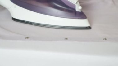 The process of ironing and steaming the shirt. Care of clothes