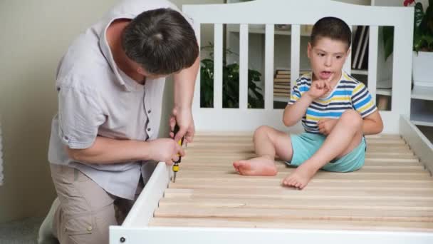 Father Son Together Assemble Childrens Bed Screw Screws Screwdriver — Vídeo de Stock