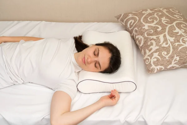 Woman Lies Orthopedic Pillow Choosing Other Different Pillows — Stock Photo, Image