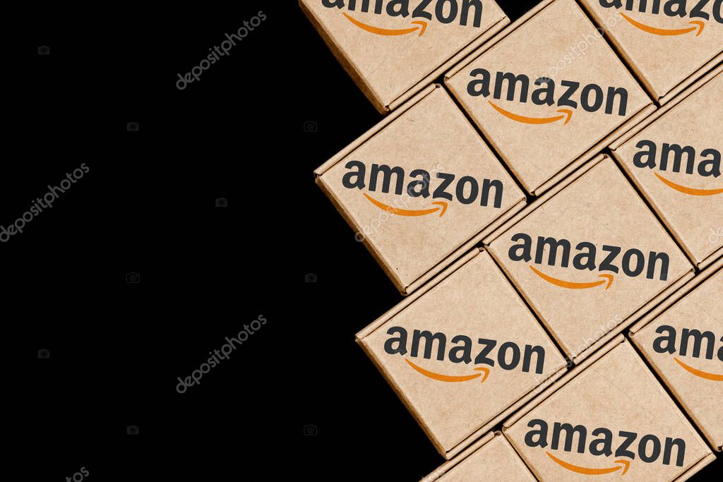 Kazan, Russia - Oct 02, 2021: Amazon is an American company, one of the world's largest e-commerce platform markets. Modified photo of packages with the Amazon logo.