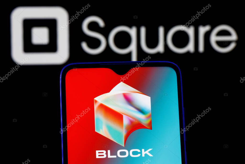 Kazan, Russia - Dec 02, 2021: Square, Inc. changes name to Block. Smartphone with Block logo on screen on background of Square logo.
