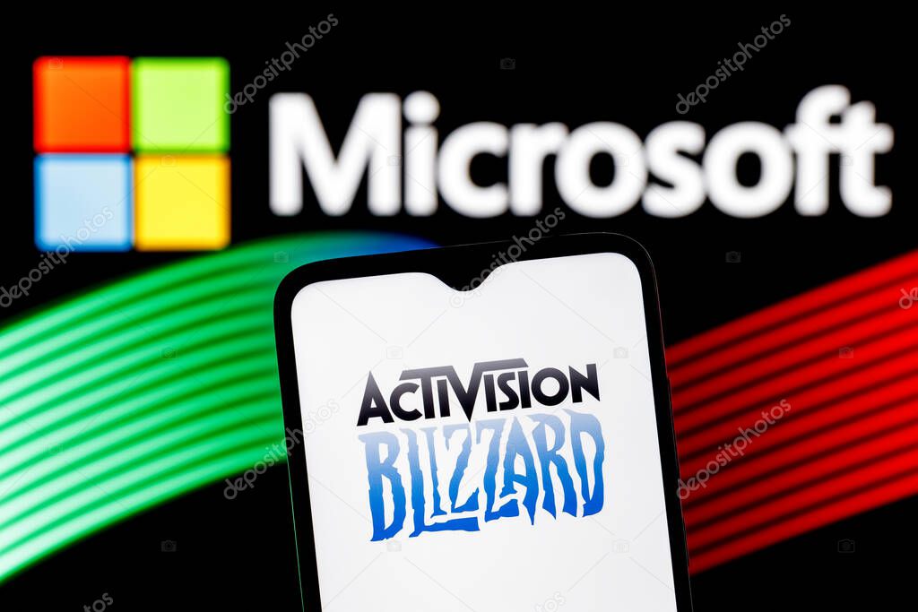 Kazan, Russia - Jan 18, 2022: Activision Blizzard logo on smartphone screen against  background of Microsoft logo. Microsoft announced buying of video game publisher Activision Blizzard.