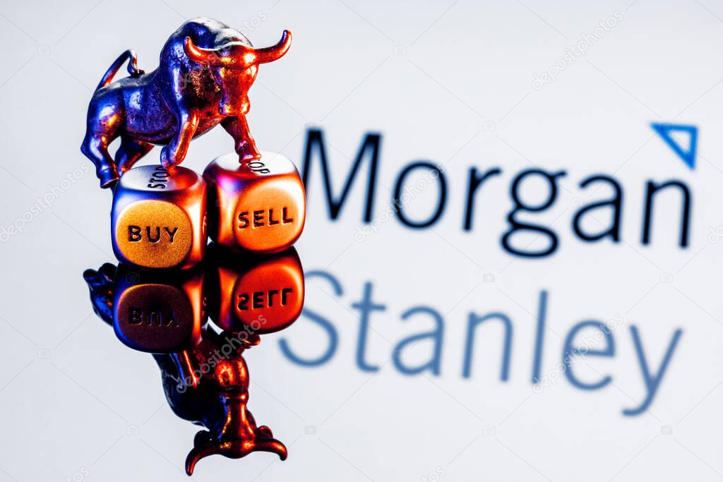 Kazan, Russia - Dec 09, 2021: Metal bull stands on buy-sell dices on background of Morgan Stanley bank logo