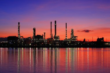 Oil refinery at twilight,Chao Phraya river, Thailand clipart