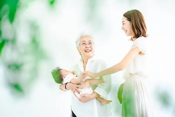 Senior Women Hugging Babies Women Watching — Stock Photo, Image