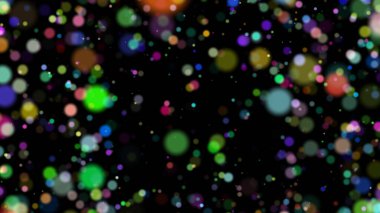 Renkli ve bulanık çemberler siyah arkaplanda düzensiz olarak hizalanır