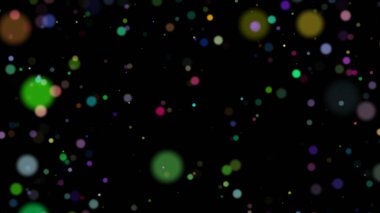 Renkli ve bulanık çemberler siyah arkaplanda düzensiz olarak hizalanır