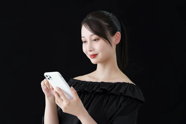 Woman Operating Smartphone Black Background — ストック写真