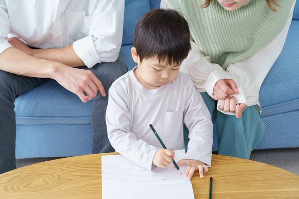 Boy Working Drawing Pencil His Parents Watching — Stock Photo, Image