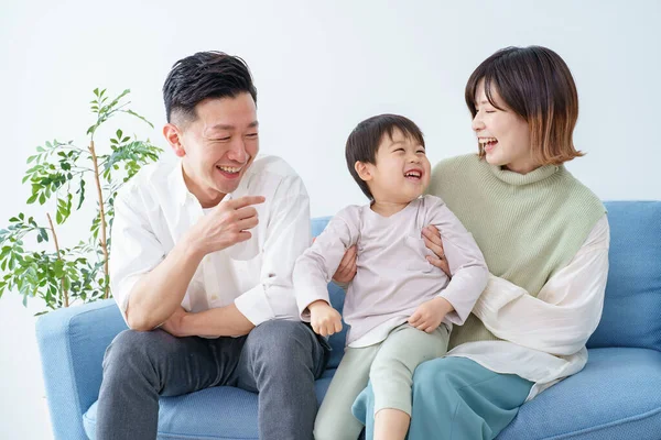 Family Relaxing Smiling Sofa — ストック写真