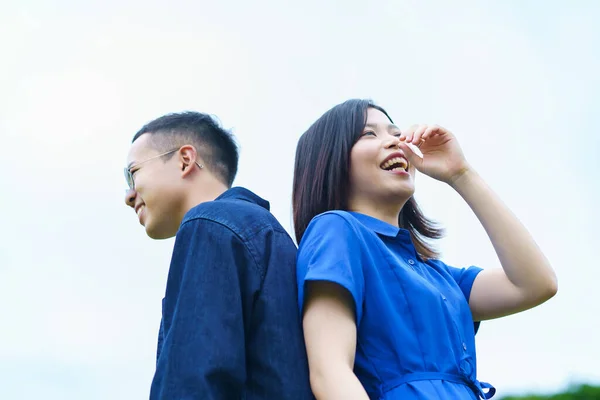 Young Couple Standing Back Back Smile — стоковое фото