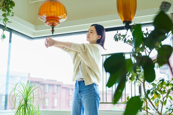 Asian Woman Stretching Room —  Fotos de Stock