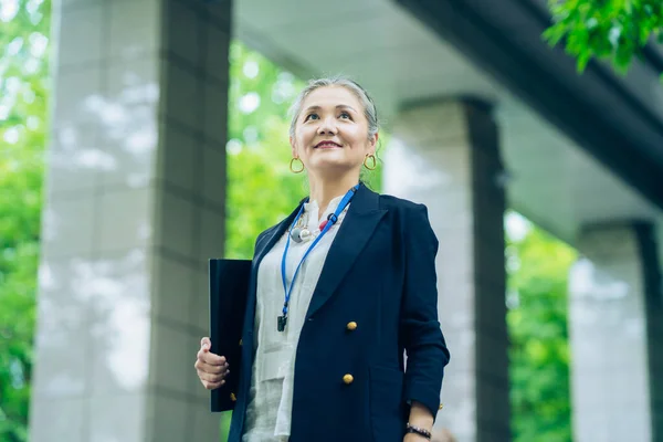 Asian Gray Haired Business Woman Standing Outdoors — Stockfoto