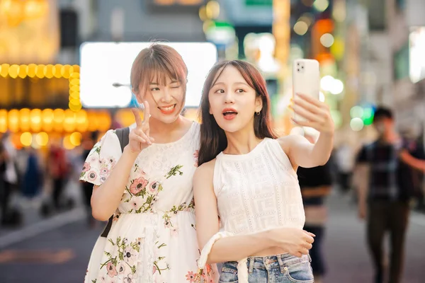 Young Women Taking Selfies Downtown — Photo